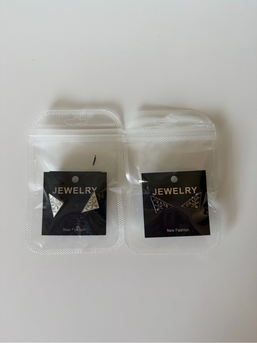 Silver Triangle Logo Stud Earrings - Jewelry